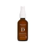 A 60 mL amber glass spray bottle of One Love Organics Botanical D Moisture Mist with a white spray cap, shown on a solid white background.