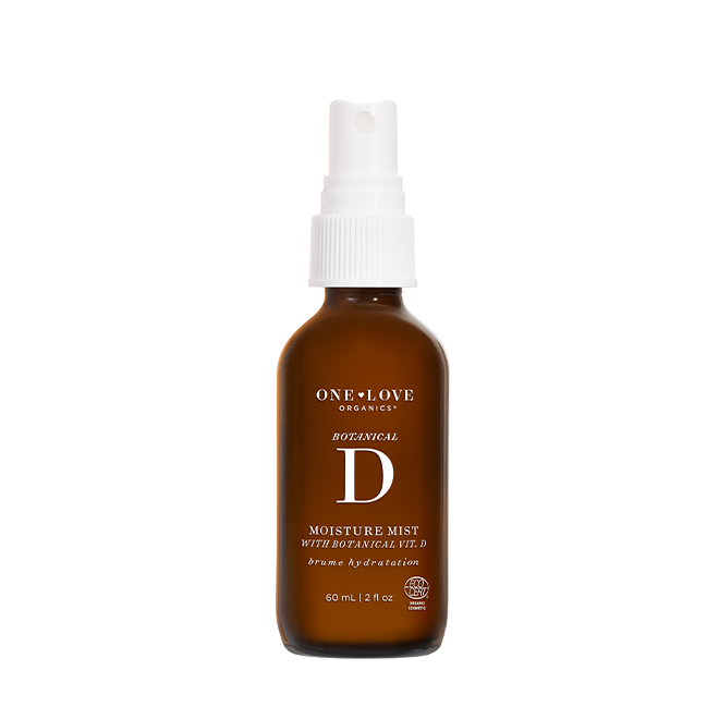 A 60 mL amber glass spray bottle of One Love Organics Botanical D Moisture Mist with a white spray cap, shown on a solid white background.