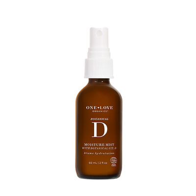 A 60 mL amber glass spray bottle of One Love Organics Botanical D Moisture Mist with a white spray cap, shown on a solid white background.