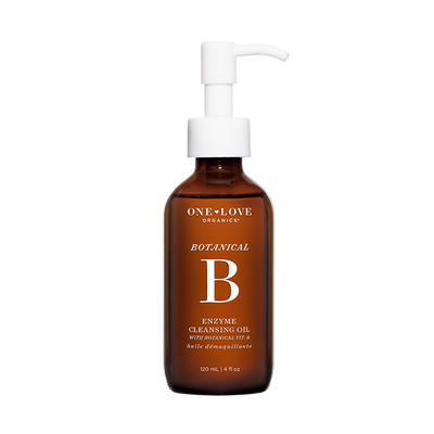 A 120 mL amber glass pump bottle of One+Love Organics Botanical B Enzyme Cleansing Oil against a solid white background.