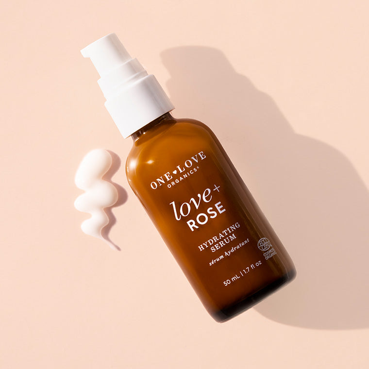 love+ Rose Hydrating Serum in an amber spray bottle with a white pump
