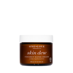 One Love Organics Skin Dew Coconut Water Cream in a dark amber brown jar with a white lid, centered on a plain white background.