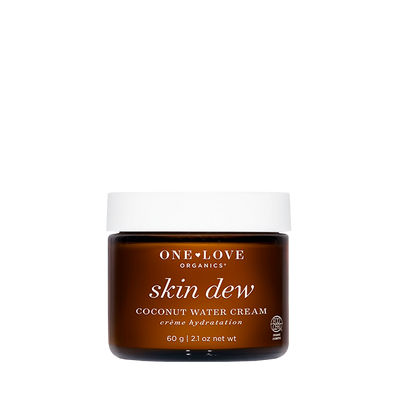 One Love Organics Skin Dew Coconut Water Cream in a dark amber brown jar with a white lid, centered on a plain white background.
