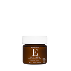 A small amber brown jar of Botanical E Eye Balm with a white ribbed cap, centered on a plain white background.