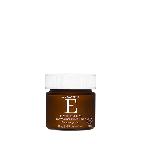 A small amber brown jar of Botanical E Eye Balm with a white ribbed cap, centered on a plain white background.