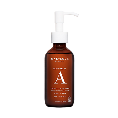 A 120 mL amber bottle of One+ Love Organics Botanical A Facial Cleanser with a white pump dispenser