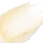 A close-up texture shot of a pale, creamy off-white cosmetic cream or gel on a solid white background.