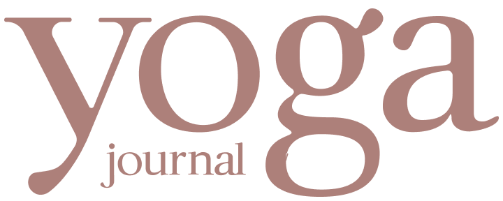 The words 'yoga journal' in a dusty rose serif typeface on a solid white background.